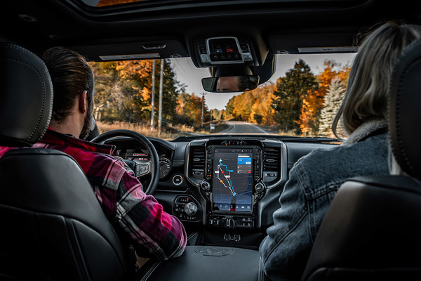 Couple looking at 12 inch Ram Touchscreen Uconnect 5 system 