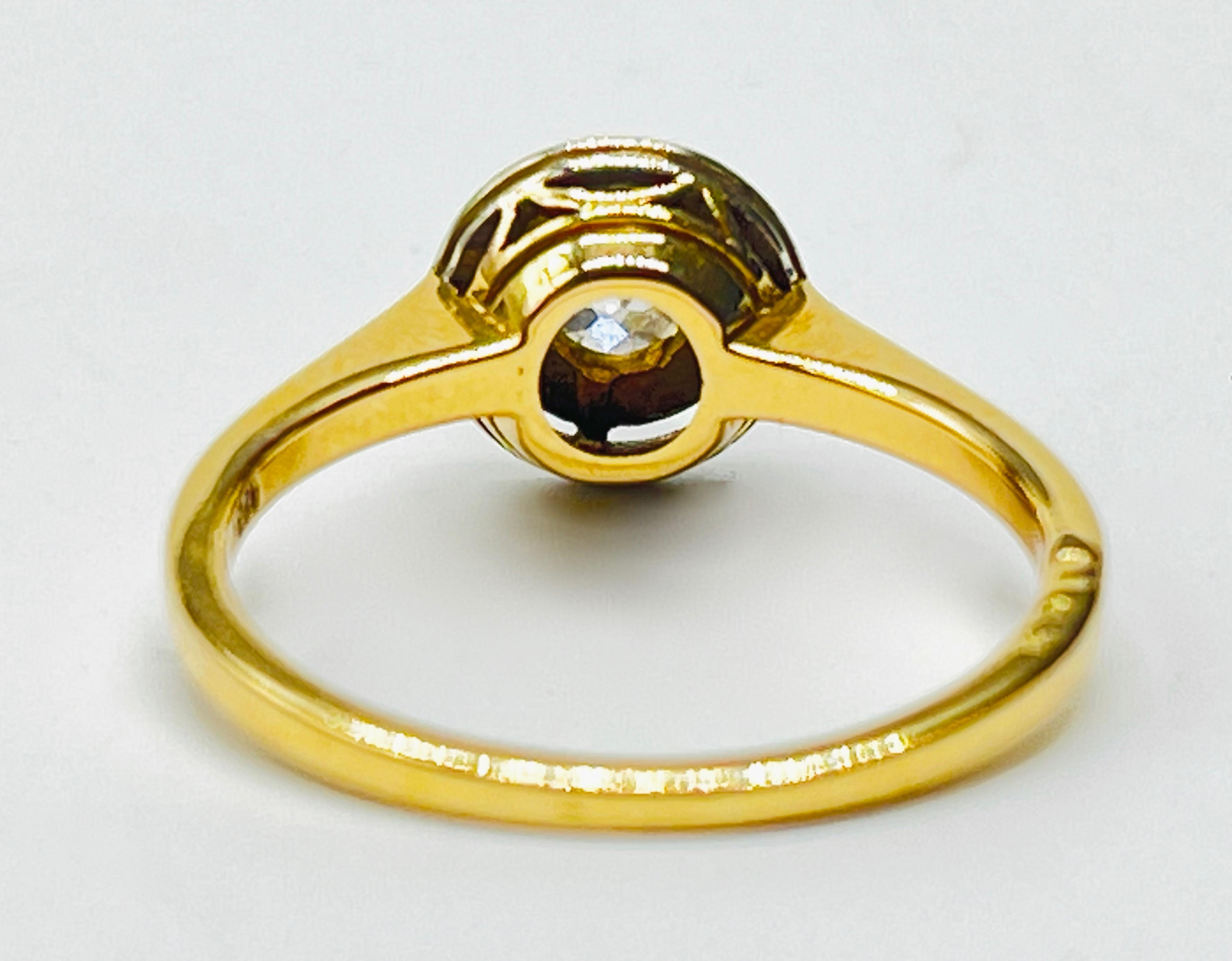 Złoty pierścionek z brylantem 0,60 ct