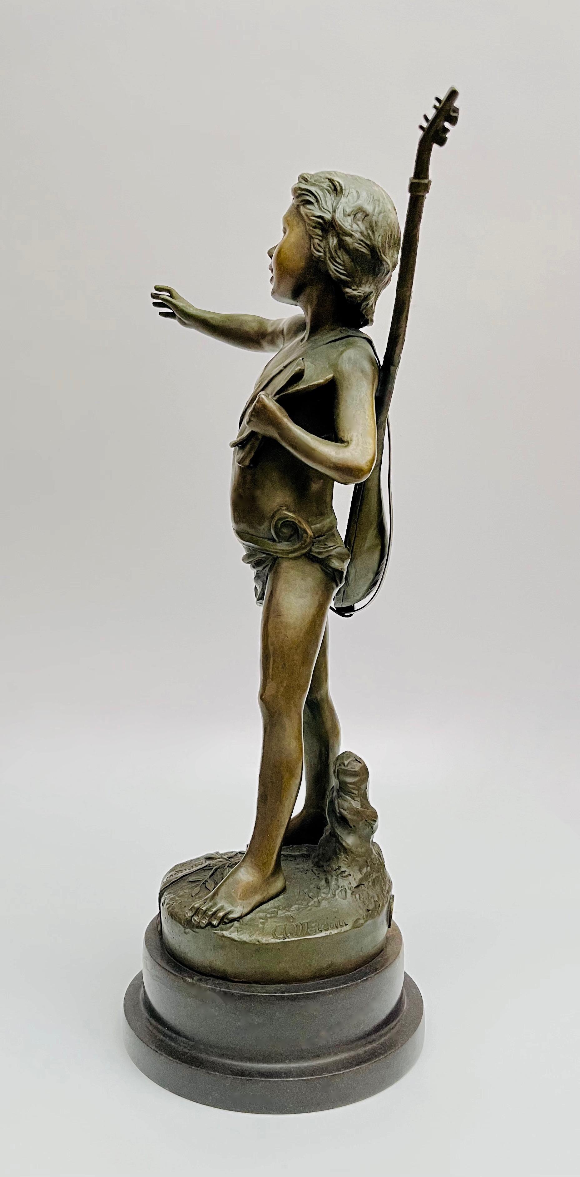 Figura chłopca z gitarą