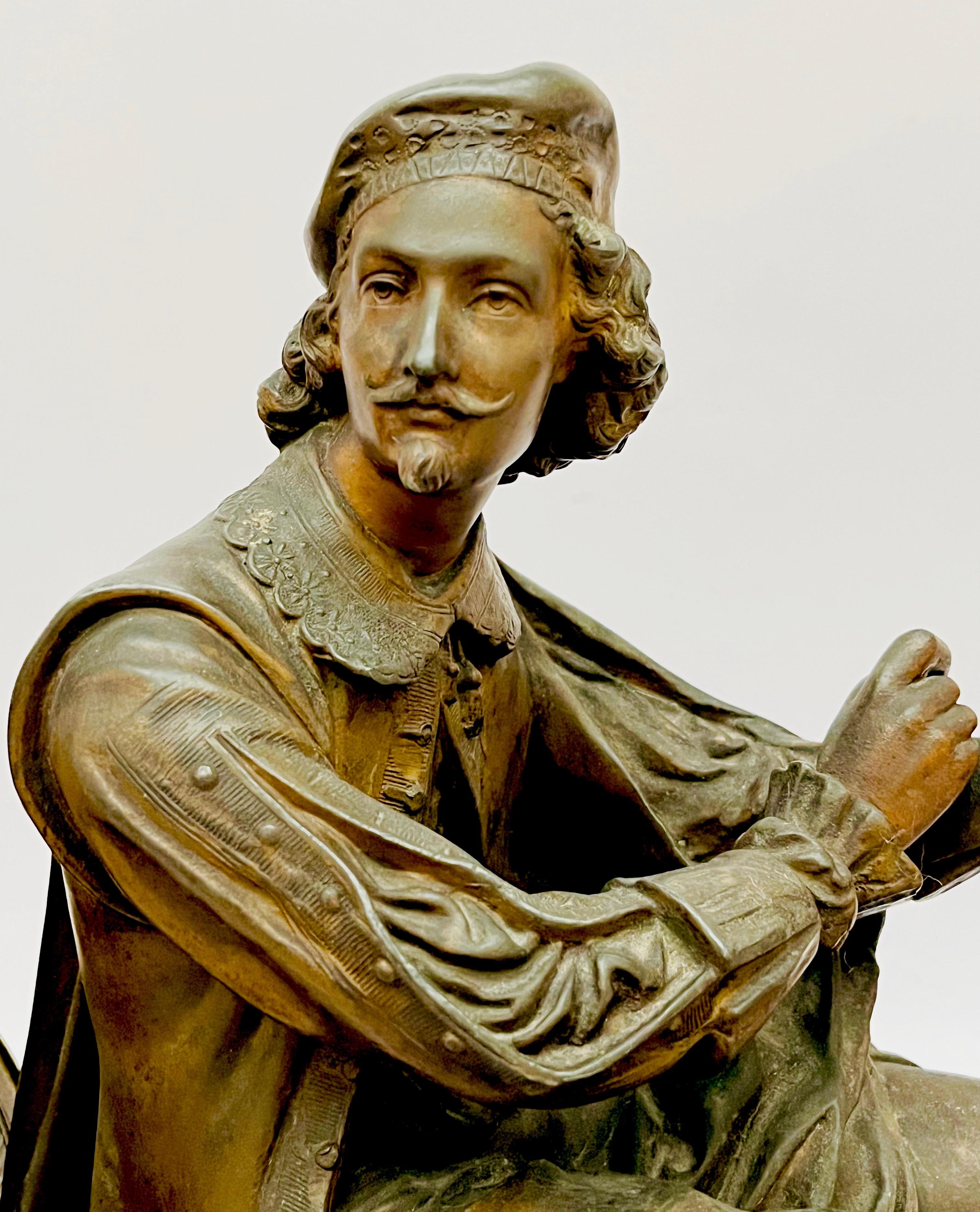 Dekoracyjny zegar zdobiony figurą renesansowego malarza Rafaela