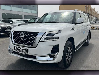 Nissan  Patrol  Titanium  2024  Automatic  0 Km  6 Cylinder  Four Wheel Drive (4WD)  SUV  White  With Warranty