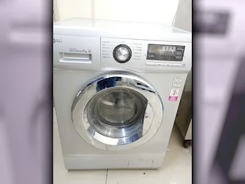 غسالة ملابس & الكل في واحد ال جي \  غسالة تحميل أمامي  فضة