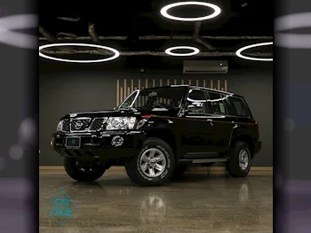 Nissan  Patrol  Safari  2024  Manual  0 Km  6 Cylinder  Four Wheel Drive (4WD)  SUV  Black  With Warranty