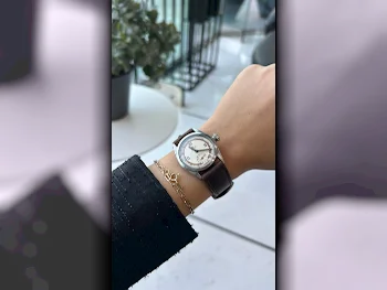 ساعات - رولكس  - ساعات ميكانيكية  - بنى  - ساعات للجنسين