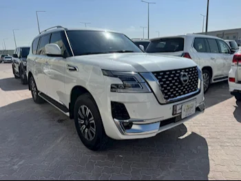Nissan  Patrol  Titanium  2023  Automatic  14,000 Km  6 Cylinder  Four Wheel Drive (4WD)  SUV  White  With Warranty