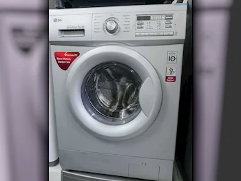 غسالة ملابس & الكل في واحد ال جي \  غسالة تحميل أمامي  اللون الرمادي