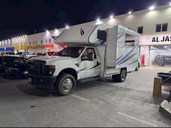 Ford  Super Duty  2010  Automatic  76,000 Km  8 Cylinder  Four Wheel Drive (4WD)  Van / Bus  White