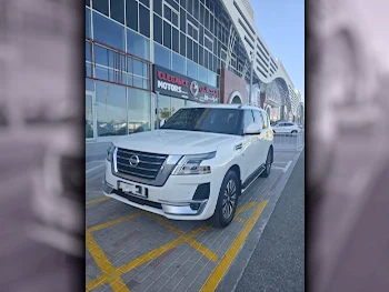 Nissan  Patrol  Titanium  2020  Automatic  26,000 Km  8 Cylinder  Four Wheel Drive (4WD)  SUV  White