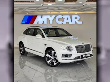 بنتلي  بينتايجا  2018  اوتوماتيك  79,000 كم  12 سلندر  دفع كلي مستمر  اس يو في  أبيض