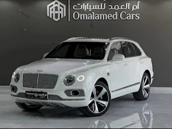بنتلي  بينتايجا  2018  اوتوماتيك  79,000 كم  12 سلندر  دفع رباعي  اس يو في  أبيض