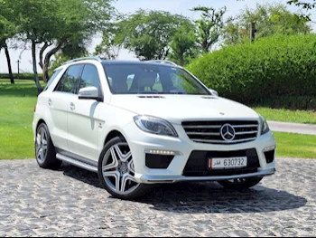 Mercedes-Benz  ML  63 AMG  2013  Automatic  114,000 Km  8 Cylinder  All Wheel Drive (AWD)  SUV  White