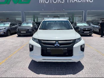 Mitsubishi  L 200  Diesel  2022  Manual  135,000 Km  4 Cylinder  Rear Wheel Drive (RWD)  Pick Up  White