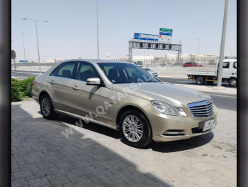 Mercedes-Benz  E-Class  200  2012  Automatic  310,000 Km  4 Cylinder  Rear Wheel Drive (RWD)  Sedan  Gold