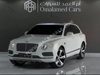 بنتلي  بينتايجا  2017  اوتوماتيك  106,000 كم  12 سلندر  دفع رباعي  اس يو في  أبيض