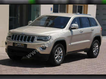 Jeep  Grand Cherokee  Laredo  2014  Automatic  140,000 Km  6 Cylinder  Four Wheel Drive (4WD)  SUV  Gold