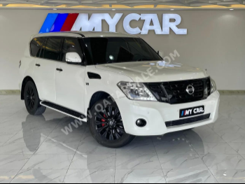 Nissan  Patrol  Titanium  2017  Automatic  118,000 Km  8 Cylinder  Four Wheel Drive (4WD)  SUV  White