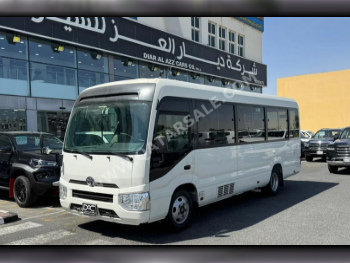 Toyota  Coaster  2020  Manual  94,000 Km  4 Cylinder  Rear Wheel Drive (RWD)  Van / Bus  White