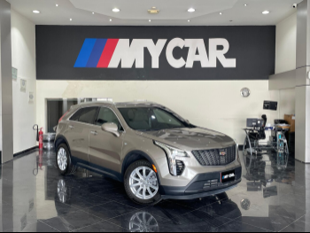 Cadillac  XT4  2023  Automatic  15,000 Km  4 Cylinder  All Wheel Drive (AWD)  SUV  Bronze  With Warranty