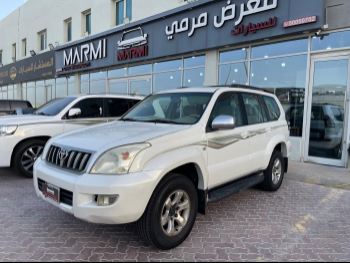 تويوتا  برادو  في اكس  2004  اوتوماتيك  243,000 كم  6 سلندر  دفع رباعي  اس يو في  أبيض