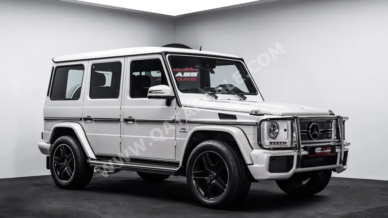 Mercedes-Benz  G-Class  65 AMG  2014  Automatic  30,828 Km  12 Cylinder  Four Wheel Drive (4WD)  SUV  White