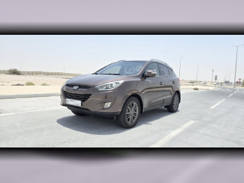 Hyundai  Tucson  2015  Automatic  92,000 Km  4 Cylinder  Front Wheel Drive (FWD)  SUV  Light Brown