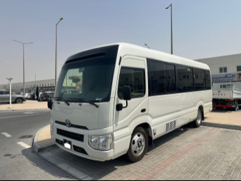 Toyota  Coaster  2023  Automatic  51,000 Km  4 Cylinder  Rear Wheel Drive (RWD)  Van / Bus  White