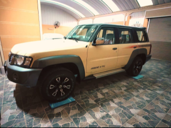 نيسان  باترول  سوبر سفاري  2024  اوتوماتيك  0 كم  6 سلندر  دفع رباعي  اس يو في  بيج  تحت الضمان