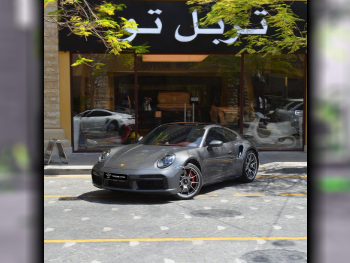 بورش  911  توربو  2023  اوتوماتيك  16,900 كم  6 سلندر  دفع خلفي  كوبيه \ سبورت  رمادي  تحت الضمان