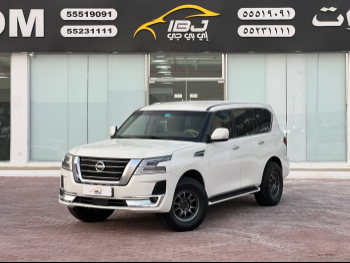 Nissan  Patrol  SE  2014  Automatic  331,000 Km  8 Cylinder  Four Wheel Drive (4WD)  SUV  White