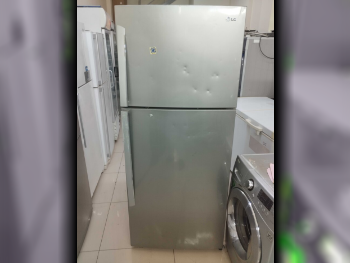 ثلاجة بفريزر علوي  - فضي