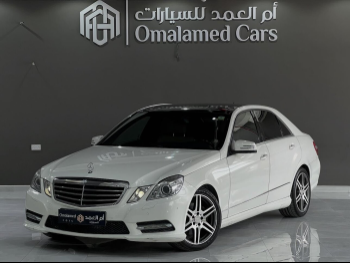 Mercedes-Benz  E-Class  350  2010  Automatic  126,000 Km  4 Cylinder  Rear Wheel Drive (RWD)  Sedan  White