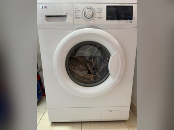 غسالة ملابس & الكل في واحد ال جي \  غسالة تحميل أمامي  أبيض