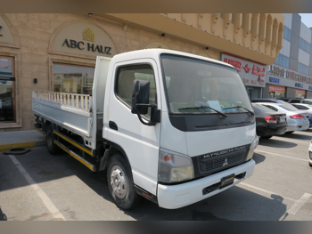 Mitsubishi  Fuso Canter  2014  Manual  400,000 Km  4 Cylinder  Rear Wheel Drive (RWD)  Pick Up  White