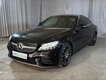 مرسيدس - بنز  سي - كلاس  200 اي ام جي  2021  اوتوماتيك  118,000 كم  4 سلندر  دفع خلفي  كوبيه \ سبورت  أسود