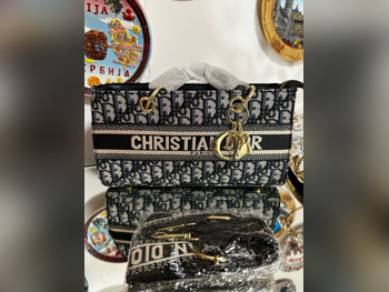 شنطة يد  - ديور  - أسود  - قماش قطني  - نسائي