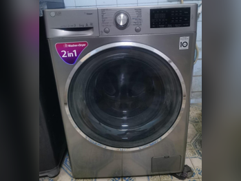 غسالة ملابس & الكل في واحد ال جي \  غسالة تحميل أمامي  فضة