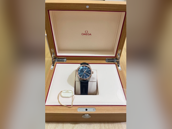 ساعات - أوميغا  - ساعات ميكانيكية  - أزرق  - ساعات للجنسين