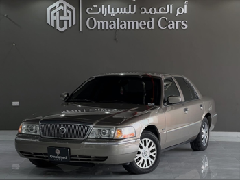 Mercury  Grand Marquis  2005  Automatic  190,000 Km  6 Cylinder  Rear Wheel Drive (RWD)  Sedan  Gold