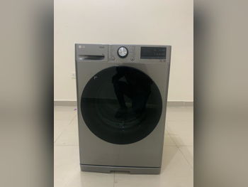 غسالة ملابس & الكل في واحد ال جي  T \  وحدة كومبو الكل في واحد  اللون الرمادي  اي ++