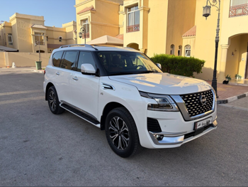 Nissan  Patrol  LE Titanium  2023  Automatic  31,000 Km  8 Cylinder  Four Wheel Drive (4WD)  SUV  White  With Warranty