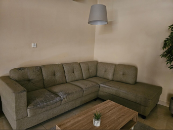 الأرائك والكنب والكراسي شكل L  - أخضر