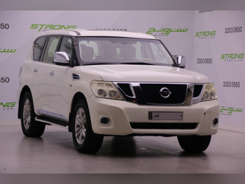 نيسان  باترول  ال اي  2013  اوتوماتيك  170,000 كم  8 سلندر  دفع رباعي  اس يو في  أبيض