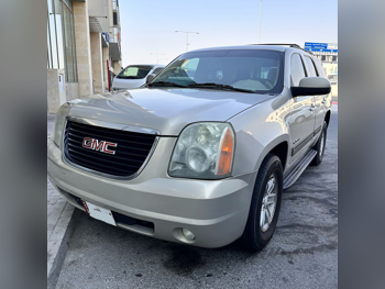 GMC  Yukon  SLE  2011  Automatic  277,000 Km  8 Cylinder  Rear Wheel Drive (RWD)  SUV  Gold