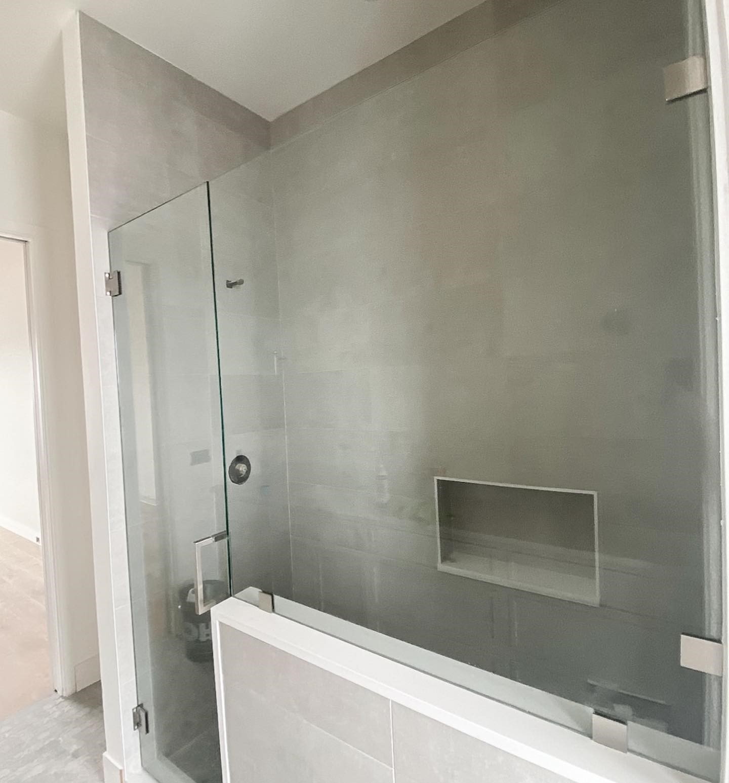 What are the different finishes of shower doors?
