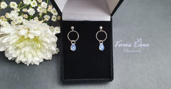 Sterling silver dangle earrings with opal while glass bead - main product image