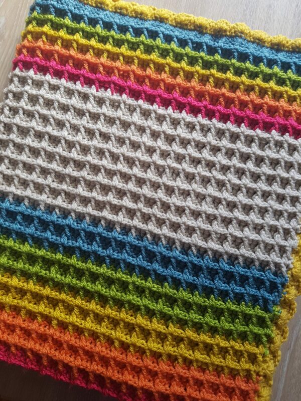 Crocheted handmade rainbow waffle blanket - main product image