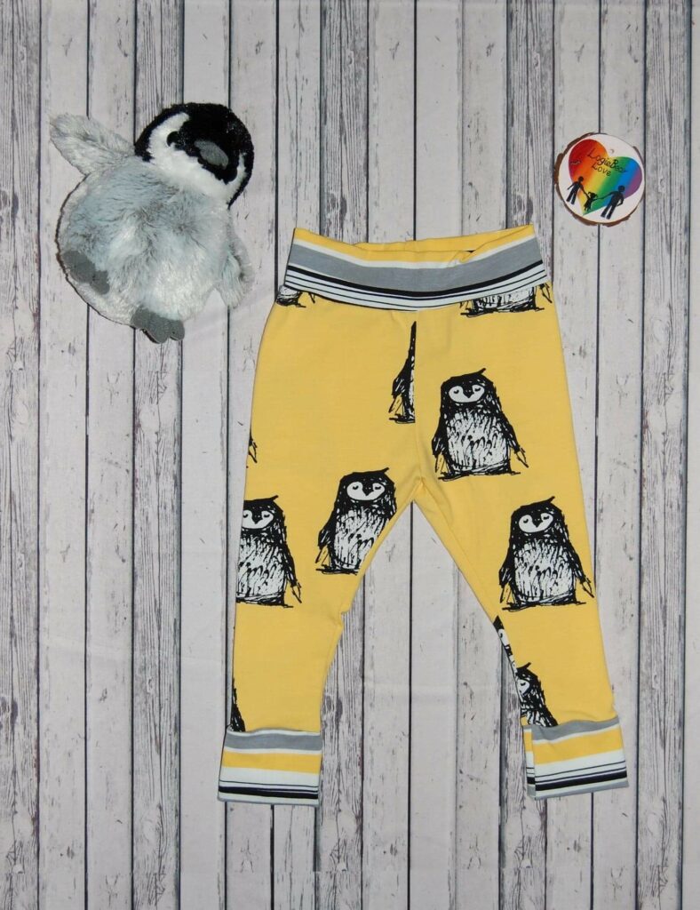 Yellow Penguin Cuffed Leggings. Size 2 years