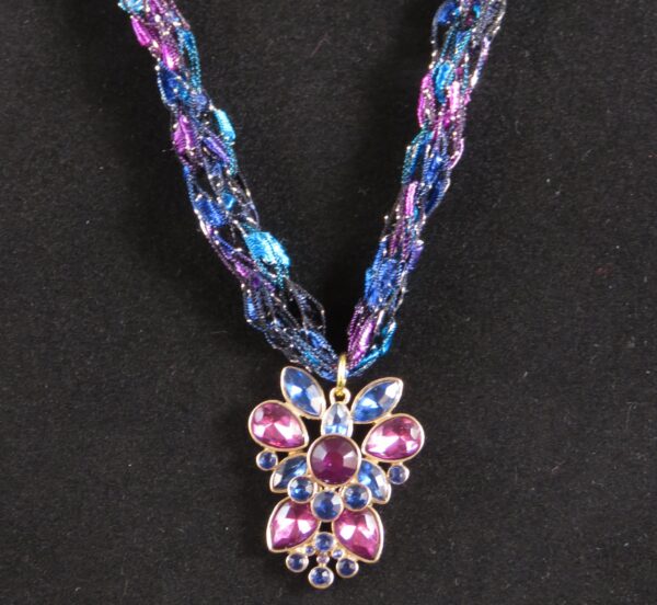 Blue purple and black necklace with floral pendant - main product image