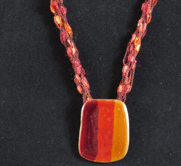 Red necklace with red and orange pendant - main product image