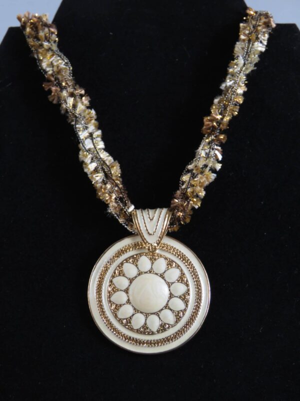 Gold necklace with white and gold circular pendant - main product image